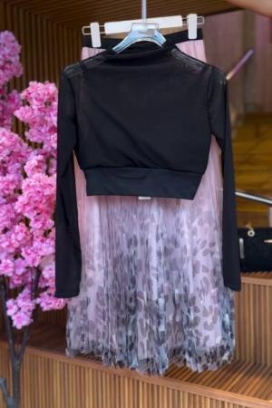 Sheer Sleeve Crop Top in Black & Abstract Pleated Skirt