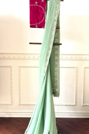 Sea Green Embellished Saree with Fuchsia Embroidered Blouse